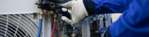 Close-up Air conditioner technician hand check fill refrigerant liquid and maintenance condenser unit, Home care service