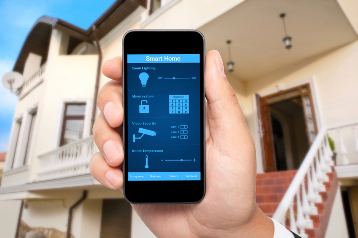 male hand hold phone with system smart house